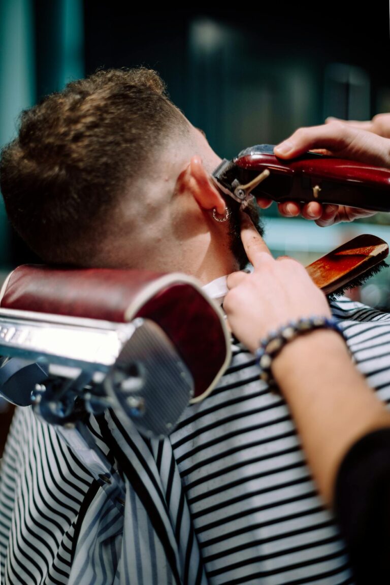 Detailed view of a barber styling hair in Geneva, Switzerland.